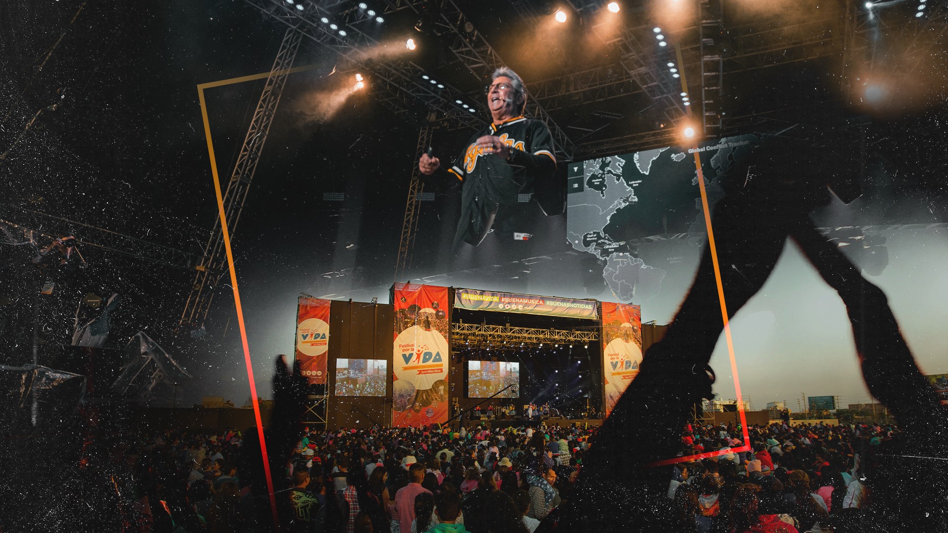 Black and white photo of teens rehearsing a dance routine on a stage.