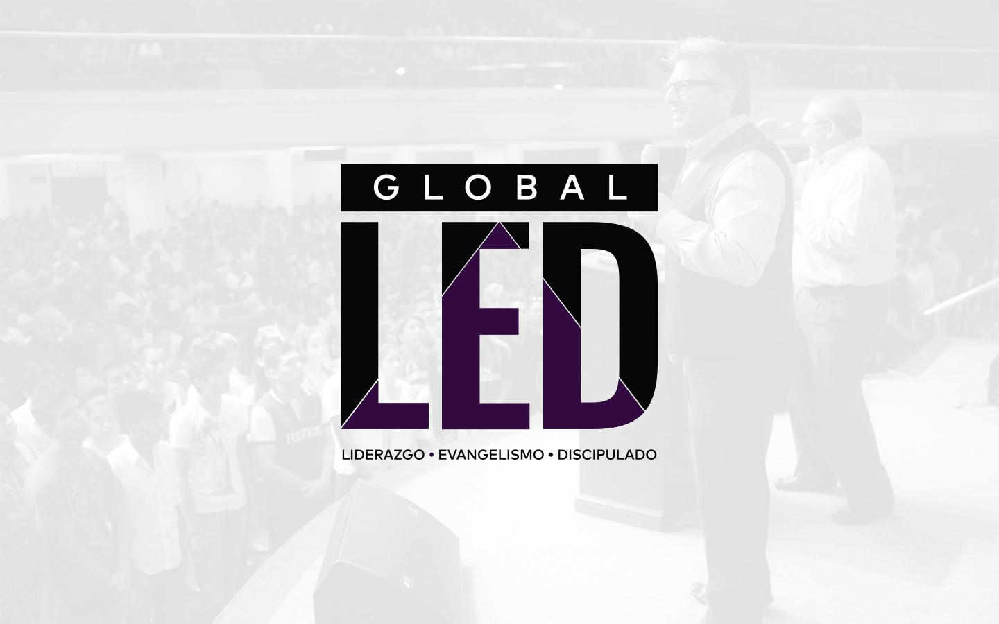 Black and white photo of teens rehearsing a dance routine on a stage.